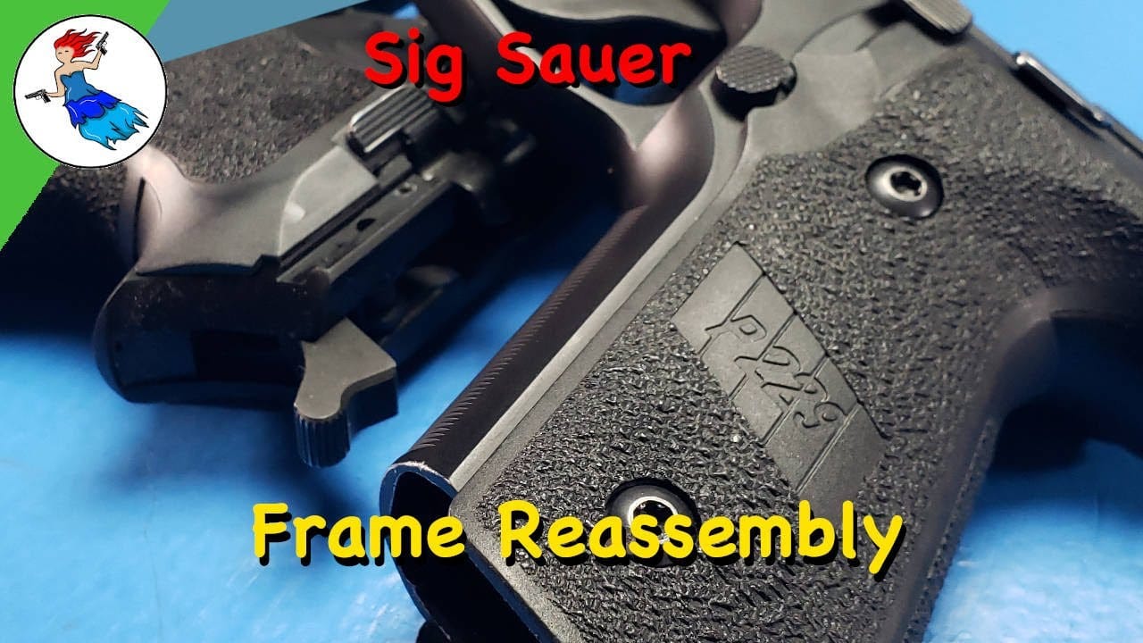 Sig Sauer Frame Assembly - Sig Sauer P229 pistol frame close-up showing grip and controls during reassembly