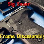 Disassemble a Sig Sauer P229 pistol frame close-up showing grip and controls before disassembly