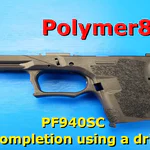Polymer80 PF940SC frame completed using a drill press on blue background